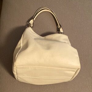 Hobo bag or expand it to tote with multiple snaps to hold your belongs in place